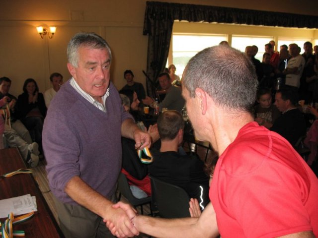 Mick Rice accepting his medal