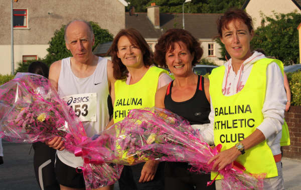 Ballina 10K Fit4Life Fun run winners..Dermot Kerr and Breege Blehin McHale being presented flowers