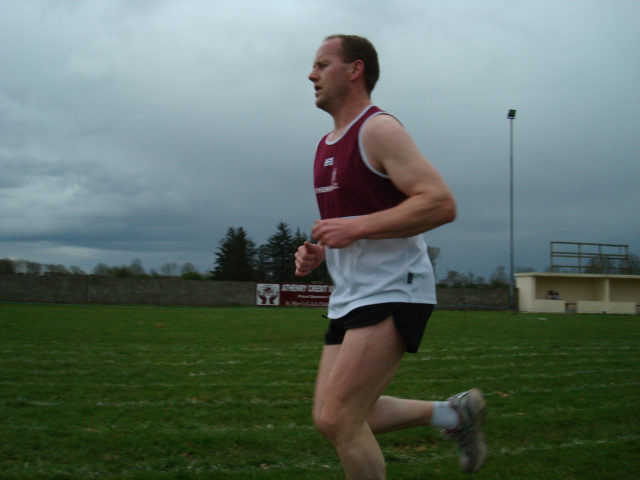 Gary powers through the field to take up the running...