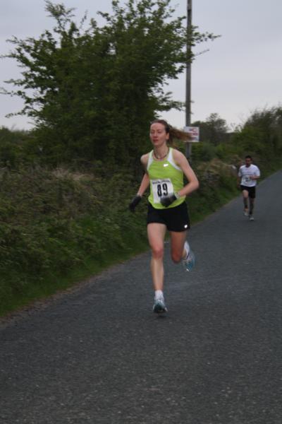 Women's race winner Mary Gleeson (Mayo AC) leads Jimmy Feeney (Mayo AC) home