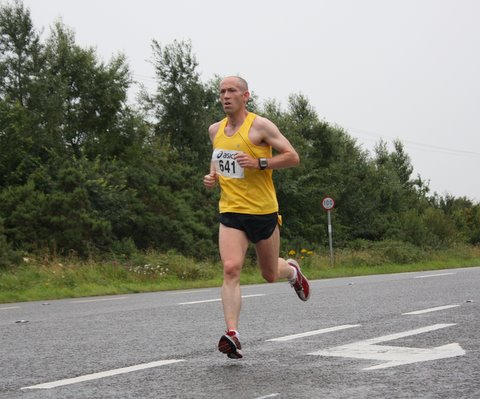 Making soft work of the hard shoulder - Ballina man Declan Fahy (Tullamore Harriers) on his way to victory in the Senior Men's r