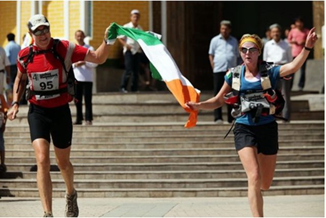 Dave and I proudly holding up the Irish flag coming into the finish line